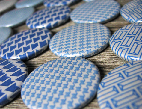 Badges made from recycled envelopes