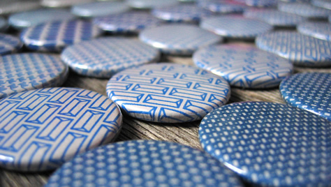 Badges made from recycled envelopes