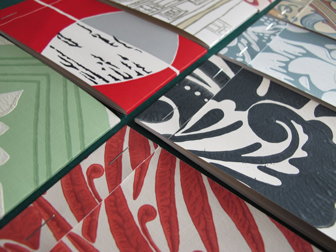 Notebooks with wallpaper sample covers