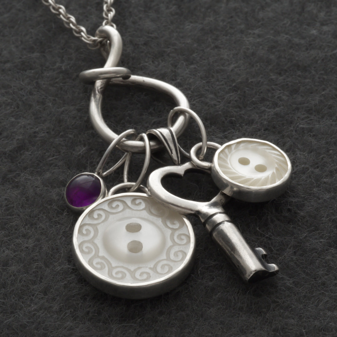 The Heirloom Button Charms set in recycled sterling silver
